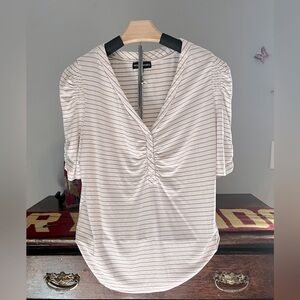 Women's shirt by modern Works. Three-quarter sleeve and never worn.